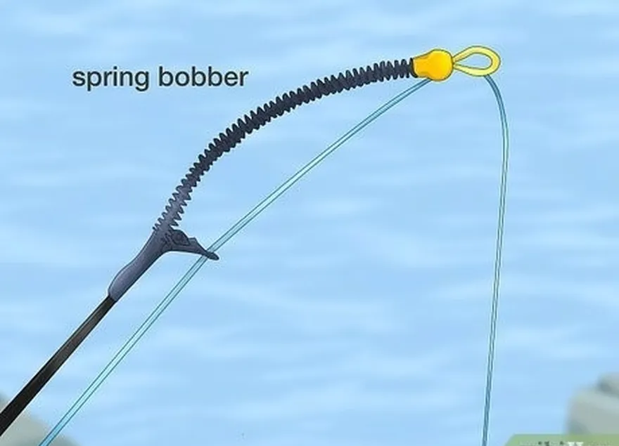 adım 5 daha akıcı bir yem veya yem hareketi için bir yaylı bobber ekleyin.